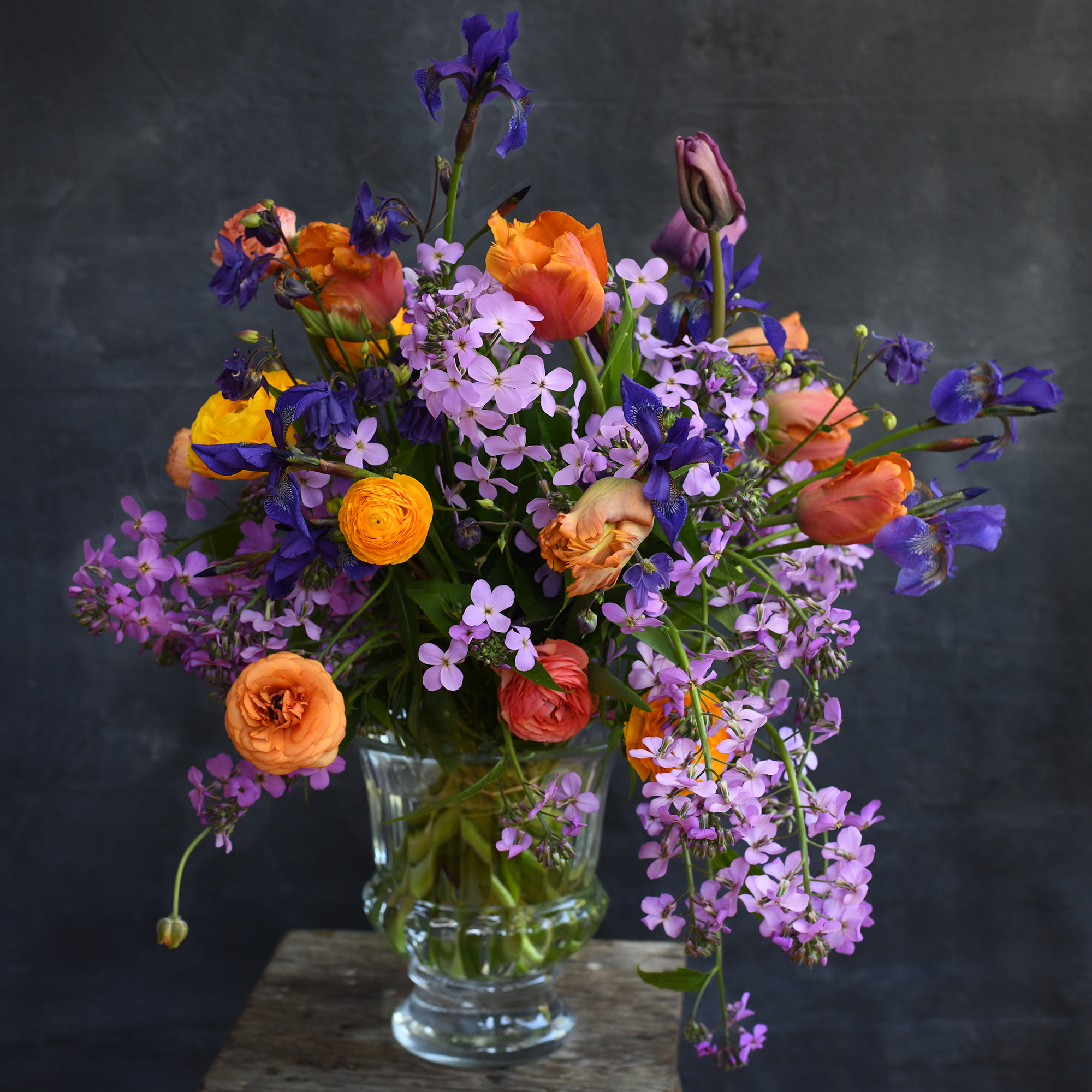 Hand-tied bouquet of fresh flowers in a glass vase